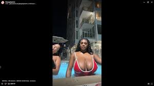 Busty goddess in pool with her friends