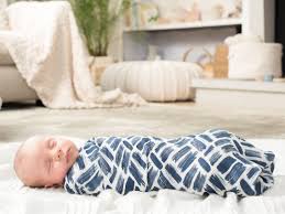 This can be on the floor or 3.lay your baby down on his back on the flipped corner. How To Swaddle A Baby A Step By Step Guide