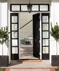 These doors are so very beautiful! Glossy Black Front Door With Black Sidelights Transitional Home Exterior
