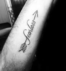 20 Fearless Tattoo Designs For Men Powerful Word Ink Ideas Fearless Tattoo Meaningful Wrist Tattoos Tattoo Designs Men