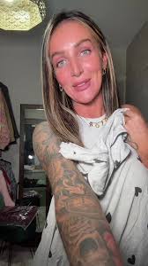 Blonde Woman Captivates with Dance Moves in Bedroom