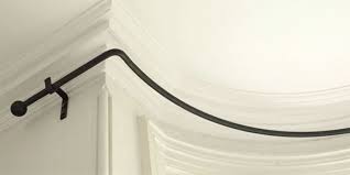 These easily bent flexible tracks can be ceiling mounted or wall mounted and offer flexible curtain rod hardware that includes smooth gliding carriers for ease in traversing your curtains or drapery. Iron Bay Window Pole Made By The Forge