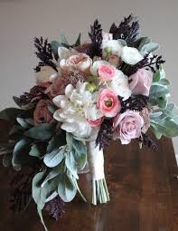 A purple wedding bouquet with anemones | brides.com. Lavender Eggplant Blush And Ivory Silk Wedding Flowers And Centerpieces Silk Wedding Flowers And Bouquets Online Love Is Blooming