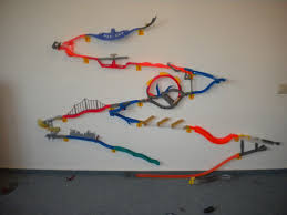 First coming out in 2011, the wall tracks use 3m command strips to stick to the wall. Hot Wheels Wall Tracks I Would Cover An Entire Wall With These And Have One Track End Up In The Car Buc Hot Wheels Wall Hot Wheels Room Hot Wheels Wall