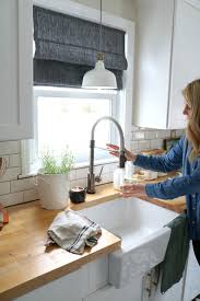 The brushed nickel finish is a perfect compliment to the stainless steel appliances we currently have and does not detract from the overall. How To Mix Metals In The Kitchen And Our Kitchen Faucet Nesting With Grace