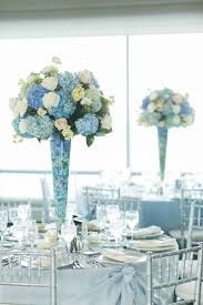 An Elegant Nyc Skyline Wedding At Manhattan Ballroom In New York New York White Rose Centerpieces Blue Wedding Centerpieces Blue Centerpieces