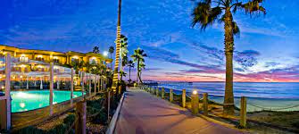 The Aaa Rated 4 Diamond Pacific Terrace Hotel Is Dramatically Perched Above The Waters Of The Pacific Ocean Terrace Hotel San Diego Travel San Diego Lodging