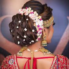 Bold Bun With Florals For A Perfect Bridal Look Wedding Hairstyles For Women Hair Styles Bridal Hair Updo