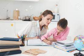 Mom Helps My Daughter Do Her Homework In The Kitchen. Stock Photo, Picture  and Royalty Free Image. Image 90456679.