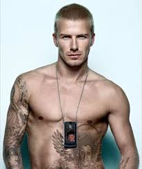 Stripping to his blue swim shorts, golden balls showed off his new england tattoo to. David Beckham Tattoos Photos David Beckham Tattoos Celebrity Tattoos David Beckham