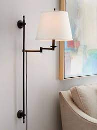 You may be initially drawn to the pinewood finish and artsy shade design, but this fixture is completely functional. The Best Plug In Wall Sconces For Every Decor Style