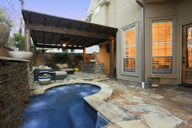 Now here's an idea if you want to keep things simple. Spool With Stack Stone Raised Beam Fire Bowls And Outdoor Kitchen Backyard Pool Small Backyard Landscaping Backyard