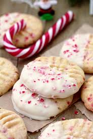 I've got a collection of easy homemade christmas candies and desserts for gifts. White Chocolate Dipped Candy Cane Sugar Cookies Sweet Spicy Kitchen