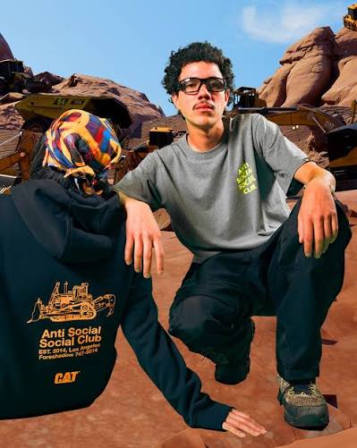 antisocialsocialclub and @catworkwear are back with a new 23-piece  collection, following their successful link-up last fall.⁠ ⁠ Rooted in  workwear, the line features bold construction graphics, safety-tone  colorways, and Caterpillar branding throughout.