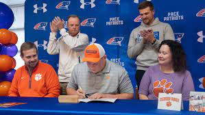 Patriots's football offensive lineman signs with Clemson University