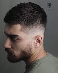 Thick hair on top is tamed with layering and texture while the sides are undercut short. 20 Cool Haircuts For Men 2021 Trends Young Men Haircuts Mens Haircuts Short Cool Hairstyles For Men