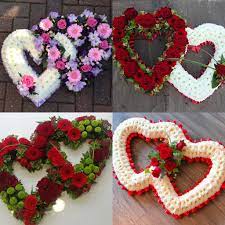 All of our roses are made to impress with larger, bolder, and more vibrant colors. Double Heart Funeral Flowers Tribute Wreath Designs Funeral Floral Funeral Flowers Flower Arrangements