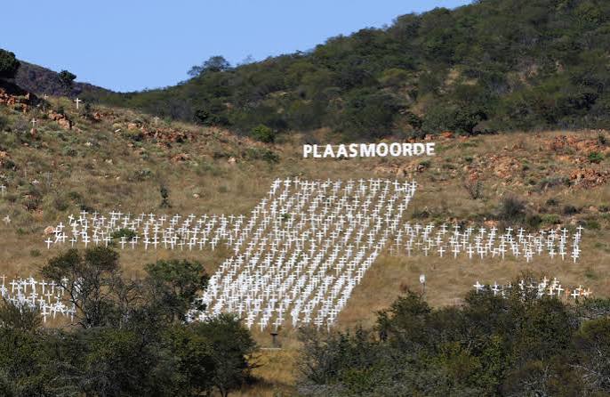 A hillside of white crosses fuels a misleading story about South Africa's farm killings | PBS News