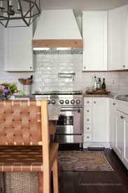 Cottage kitchen designed with white and blue mosaic cooktop accent tiles surrounding carrera mini subway backsplash tiles. 8 Ways To Update Kitchen Cabinets Unexpected Elegance