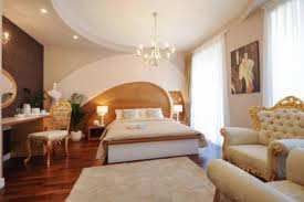 Gold lamps, gold beds, gold wall decor, gold accessories, gold pillows, gold frames, gold wall paper. Silver Gold Luxury Rooms Hotel Zadar Croatia Overview