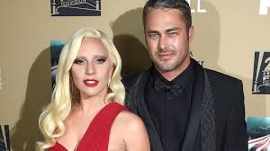 Lady gaga and her boyfriend, michael polansky, are now instagram official. Lady Gaga Makes Red Hot Rare Appearance With Fiance Taylor Kinney At American Horror Story Premiere Entertainment Tonight