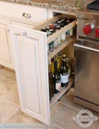 We could not move the stove without making it off center of the exhaust hood. Spice Up Your Kitchen Storage Normandy Remodeling