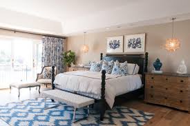 A sea blue rug and white walls and beams create a light and airy feel in this bedroom. 12 Beautiful Blue And White Bedrooms
