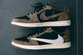 This collaborative air jordan 1 features a mix of earthy brown nubuck and white leather, and although it's not shown, a cactus jack tongue badge alongside a hidden pocket around the ankle. Travis Scott X Air Jordan 1 Low On Feet Closer Look Photos Hypebeast