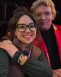 Tres Amigas Phone Call: “Cough- are we still going?” “You're the only one  that feels sick….” Mom: “it's late shouldn't you get ready” Everyone rolls  up: flares open kimono- “tired whatever, wants