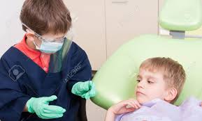 I saw him this morning downtown. Kid Dentist Doctor And Child Patient Having Fun In Dental Office Stock Photo Picture And Royalty Free Image Image 41822797
