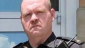 This is the Adams County Sheriff that laughed at me, and sarcastically told  me with a smirk he was not putting my door bacc up