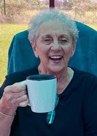 What is the significance of the elderly widow in Luke 2:38?