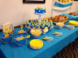 Rubber Ducky Cupcakes Were Purchased At Walmart And They Were Great I Used Kids Sand Buckets For Baby Shower Duck Ducky Baby Showers Rubber Ducky Baby Shower