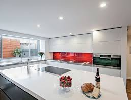 White kitchen cabinets with thunder white granite countertops. Dulux Whisper White Poly