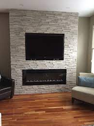 Mounting a tv above stone fireplace produces a beautiful centerpiece and opens up table space. Pin On Decorating Ideas