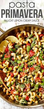 30 Minute Pasta Primavera Loaded With Fresh Veggies And Tossed In A Light Garlicky Lemony Cream Sauce Pasta Primavera Pasta Primavera Recipe Pasta Dishes