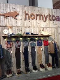 Garage is a clothing store, primarily targeting young women. Outdoor Retailer Winter Market 2014 Best Of Booth Awards Visual Merchandising Retail Store Design Clothing Store Design