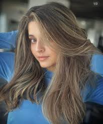 She came in with her natural grown out with old color that had turned to a  brassy color and she wanted a natural brown root with highlights. I went in  with an