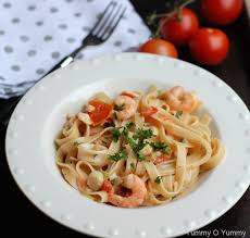 This seafood pasta is simmered in a tomato basil sauce and then sprinkled with fresh basil at the end. Seafood Pasta In A Creamy Tomato Sauce Yummy O Yummy