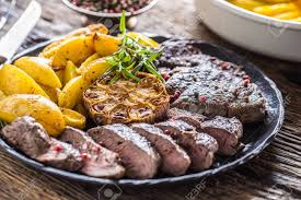 Maybe you would like to learn more about one of these? Grilled Beef Rib Eye Steak With Garlic American Potatoes Rosemary Stock Photo Picture And Royalty Free Image Image 128231521