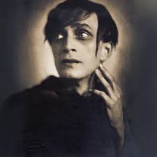 Pictured, Irene Ware is confronted by Lugosi in CHANDU.