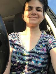 What is the make and model of the red car?