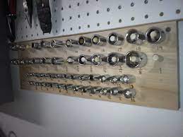 This will prevent the door from shooting up and breaking your nose when you wind the new springs during an overhead garage door repair. A Better Socket Organizer Diy Garage Storage Socket Organizer Garage Workshop Organization