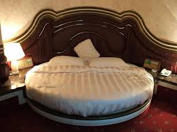 Round Bed Alluring Round Shape Bed Decoration With Glamorous Brown Headboard For Wonderful Bedroom In Minimalist Bedroom Apartment Bedroom Decor Modern Bedroom