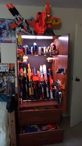Since these nerf guns occupy our playroom, it made sense to find a better way to store them and this makeover challenge was a perfect time. Showing Off Nerf Cabinet Adhesive Suggestions Nerf