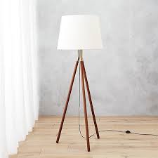 Shop Tres Floor Lamp Classic Silhouette Shines Anew Tripod Legs In Warm Rubberwood Come Together In A Gleam Of Gol Floor Lamp Lamp Brushed Gold Floor Lamp