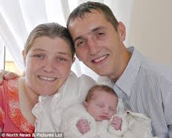 Pictured: Mother told by doctor she'd miscarried proudly shows off her  healthy newborn baby