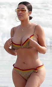 Kim Kardashian busts out of her skimpy bikini | Daily Mail Online