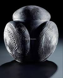 This 5,000-year-old carved stone ball is from northeast Scotland, and is  about the size of a tennis ball. Most carved stone balls from the Neolithic  era are geometric or knobbed. This one