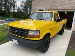 Image result for Bright Yellow 1990 Truck